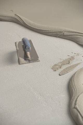 Socrete aanbrengen met spatel op chape