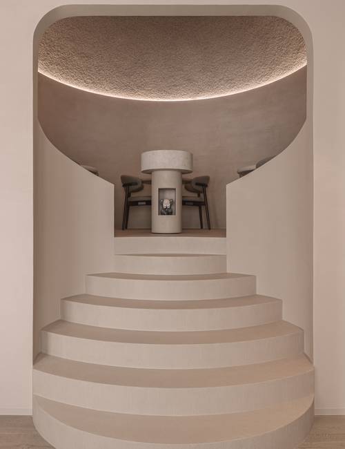 Carran on stairs and floor in dining room at Rebelle restaurant