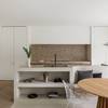 Kitchen with interconnected seating area and cupboard in Socrete