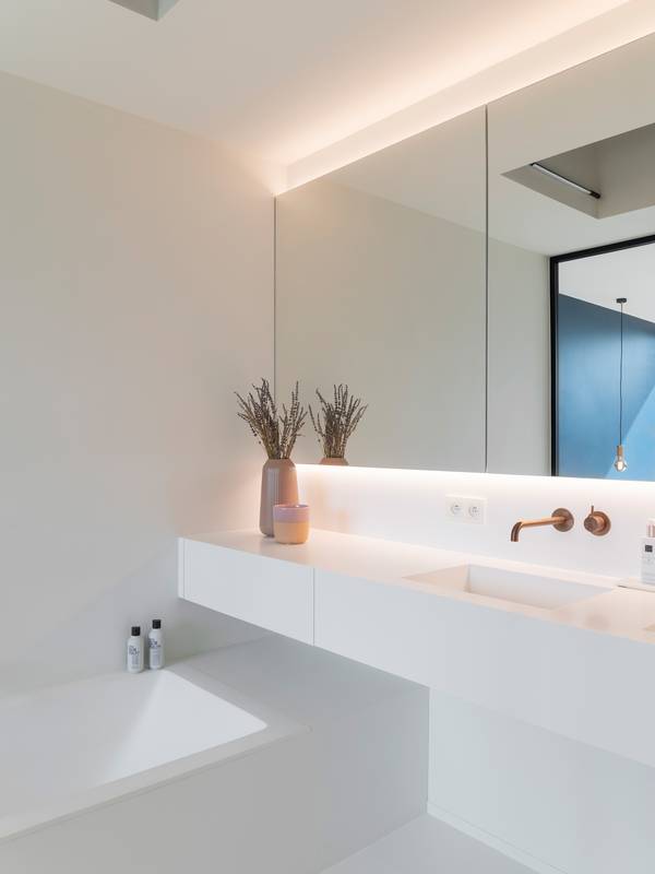 white bathroom with bathtub and washbasin