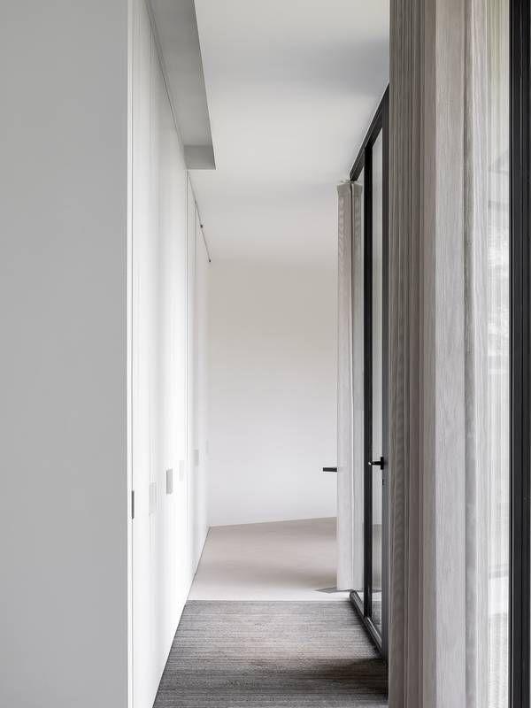 Socrete in corridor with recessed floor mat